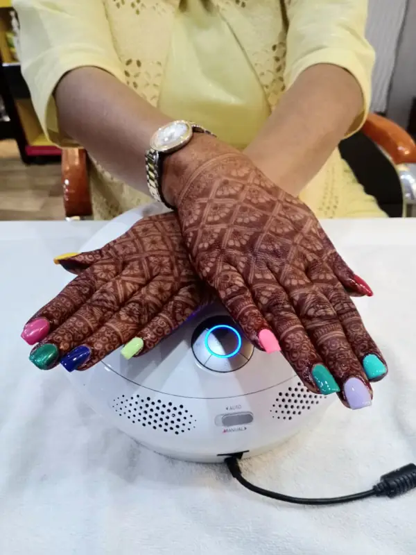 Traditional mehendi design application on hands